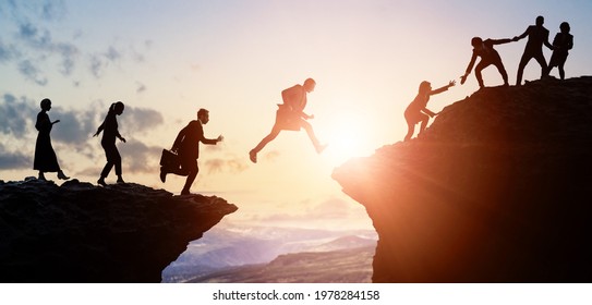 Challenge of business concept. Group of businesspeople climbing a mountain. Teamwork. Success.