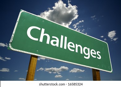 Challenges Road Sign with dramatic clouds and sky.