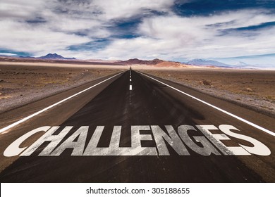 Challenges written on desert road