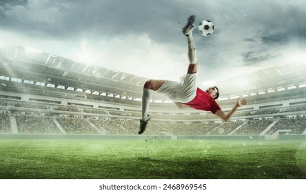 Challenging goal. Man, soccer player in motion during game hitting ball and falling down on grass. Winning match. 3D stadium. Concept of sport, competition, tournament, games, event - Powered by Shutterstock