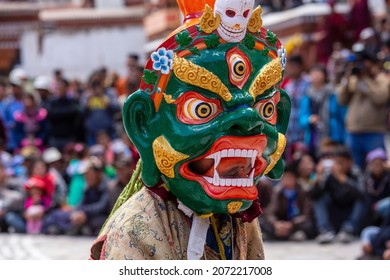 Cham dance of Hemis festival is the masked dance, performed by the lamas, that celebrates victory good over evil at Ladakh, North India. Tibetan man performing a dance