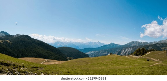 Chamois, Valle d'aosta, Aosta: there is the landscape on the Cervino. there are montains and trees. the sky is blue and clean with some with clouds. 