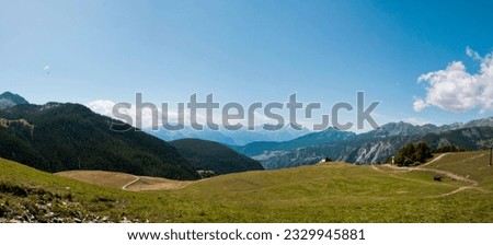 Chamois, Valle d'aosta, Aosta: there is the landscape on the Cervino. there are montains and trees. the sky is blue and clean with some with clouds. 