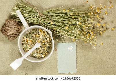 Chamomile, camomile. Dry herbs for use in alternative medicine, phytotherapy, spa or herbal cosmetics. Preparing infusions, decoctions or tinctures. For powders, ointments, oil or tea, bath. - Shutterstock ID 1966692553