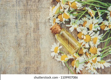 Chamomile Extract In A Small Bottle. Selective Focus. 