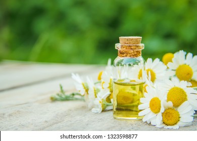 Chamomile Extract In A Small Bottle. Selective Focus Nature.