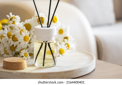 Chamomile flavour air freshener, home aroma fragrance diffuser in bed over. Healthy lifestyle and interior elements