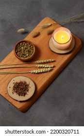 Chamomile Flower Tea In Glass Tube On Wooden Board. Contrast Rustic Style.