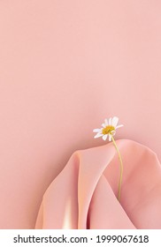 Chamomile On Pink Fabric Background.  Aesthetic Minimal Wallpaper. Stylish Plant Composition