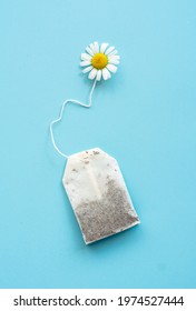chamomile tea bag, herbal chamomile tea with fresh daisy flowers background, treatment and prevention of immune concept	
