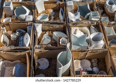 Chamonix, France - 23 March 2019: Closeup of various white porcelain items on display in trays crates and boxes at Saturday market place in Chamonix France - Shutterstock ID 1427785229