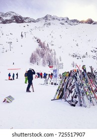 Chamonix, France - January , 24, 2015: People Skiing, Pile Of Skis And Slopes View At Les Grands Montets Ski Area Near Chamonix, France