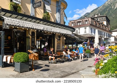 Chamonix, Haute Savoie, France - 07 25 2022: People Sitting At An Outdoor Bistro In The Centre Of The Mountain Town In Summer