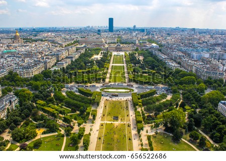 Champ de Mars view from top of eiffel tower looking down see the entire city as a beautiful classic architecture. A romantic place for lovers and family to visit. 