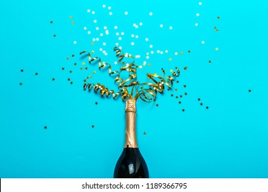 Champagne bottle with colorful party streamers