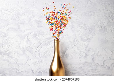 Champagne Bottle With Confetti Flat Lay Top View