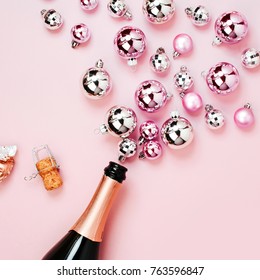 Champagne Bottle With Pink And Silver Christmas Balls. Flat Lay, Top View Trendy Holiday Concept.