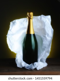 Champagne Bottle Still Life: A Bottle With No Label With Tissue Paper Wrapping Pulled Back 