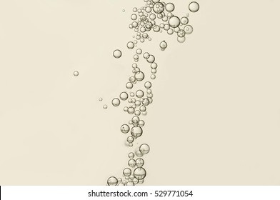 Champagne bubbles soars over a blurred background