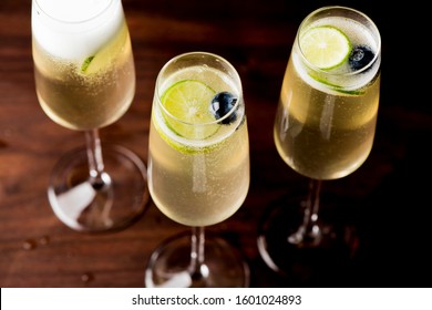 Champagne cocktails. Traditional American craft cocktails made by artisanal bartenders or mixologists in speakeasy & upscale bars or dive bar taverns. Cocktails served in chilled cocktail glasses. - Shutterstock ID 1601024893