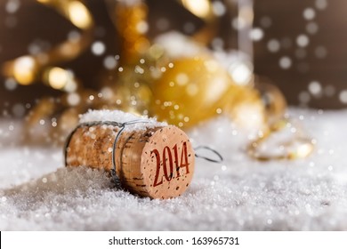 Champagne corks with 2014 year stamp in snow