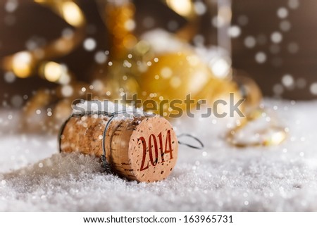 Champagne corks with 2014 year stamp in snow