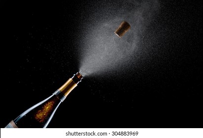 Champagne explosion on black background