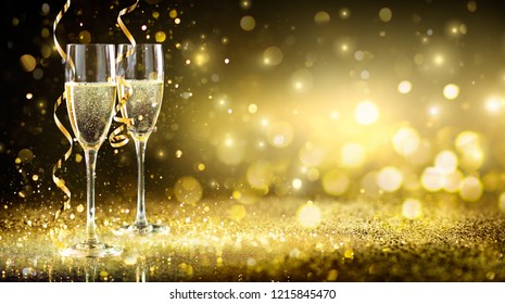 Champagne Flutes In Golden Sparkle Background - Happy New Year
