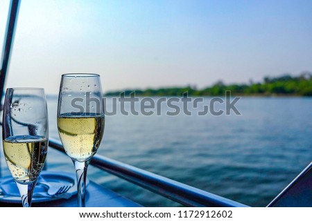 Champagne on a sunset cruise on the Zambezi River, Victoria Falls, Zimbabwe