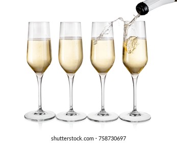 Champagne pouring in four in line glasses