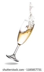 Champagne splash out of glass isolated on white background.