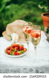champagne with strawberries in the garden