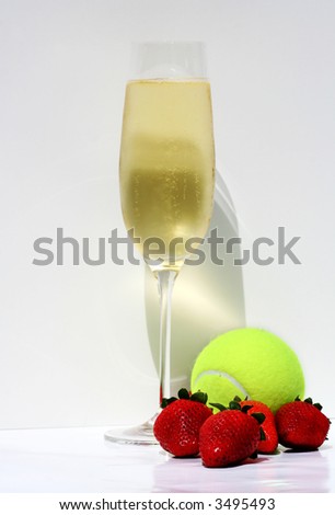 Champagne, strawberries and tennis ball representing Wimbledon tennis tournament