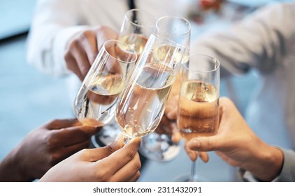 Champagne, toast and business people at an office party in celebration of success together closeup. Hands, glass and cheers with a team or group of colleagues in the workplace to celebrate a goal - Powered by Shutterstock