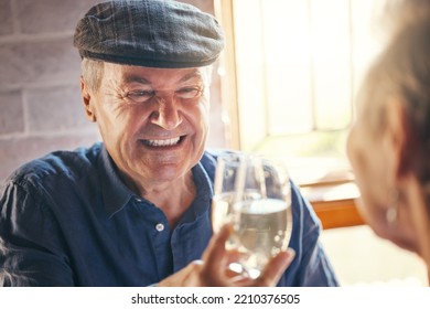 Champagne Toast, Celebration And Senior Couple With Smile About Retirement At Restaurant. Elderly Man And Woman At Dinner To Celebrate Anniversary, Marriage And Love With Drink Of Wine And Cheers