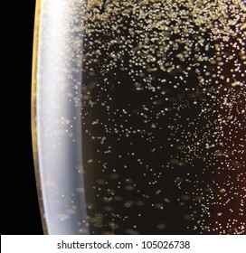 champagne in wineglass on a black background.Saved clipping path.