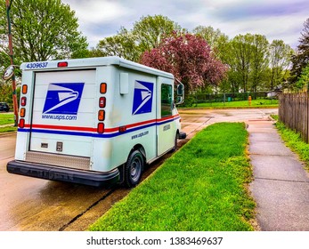 Champaign IL USA April 27, 2019 :!US Postal Service Truck Or In Another Name Is LLV (Long Life Vehicle) Park By The Side Of The Road After The Rain