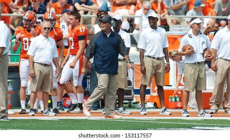 CHAMPAIGN,IL-AUGUST 31: Illinois Head Coach Tim Beckman Checks The Scoreboard Just Before The Start Of The Second Quarter On Saturday, Aug 31, 2013.