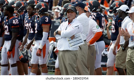 CHAMPAIGN,IL-SEPTEMBER 28: University Of Illinois Head Football Coach Tim Beckman Pensively Looks At The Score Board During A Game On Saturday, Sept 28, 2013.