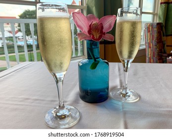 Champange Glasses With Table Flowers. 