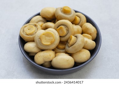 Champignon mushrooms in brine. Canned champignon mushrooms whole - Powered by Shutterstock