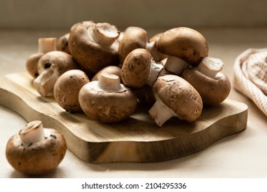 Champignons fresh mushrooms on cutting board - Powered by Shutterstock