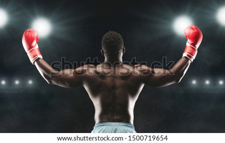 Black guy boxing in gym