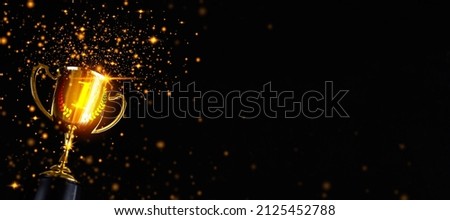 Champion golden trophy isolated on black background. Concept of success and achievement.Champions award, sport victory, winner prize concept. Competition success, first place, best win symbol.