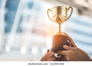Champion golden trophy for winner background. Success and achievement concept. Sport and cup award theme. - Shutterstock ID 1113947324