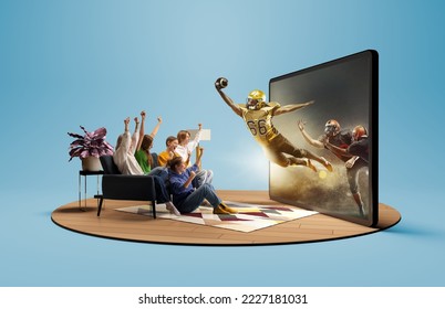 Champion. Presence effect. Astonished thrilled youth, girls and boys sitting in front of huge 3D model of TV screen at home interior and watching online broadcast of american football match - Powered by Shutterstock