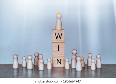 Champion and win concept.Wood block with and word win,wooden doll, Business and success concept. - Shutterstock ID 1906664947