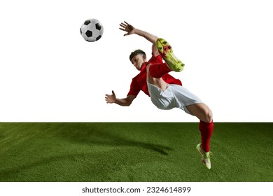 Champion. Young man, professional football player in motion, kicking ball in jump and falling on field against white background. Concept of professional sport, action, competition, training, ad - Powered by Shutterstock