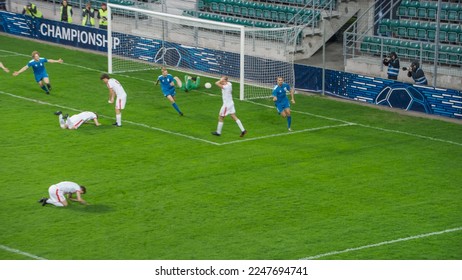 Championship Match: Blue Soccer Football Team Attack, Player Run Happy after Scoring Goal, Celebrate Victory, Hugging With Teammates. Sport Channel Broadcast Television Concept. - Powered by Shutterstock