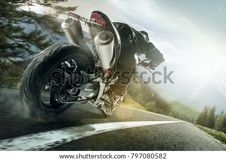 Championship of motocross, side view of sportsmen driving motorcycle
